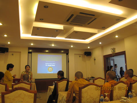 Minh Chau welcoming audience to seminar